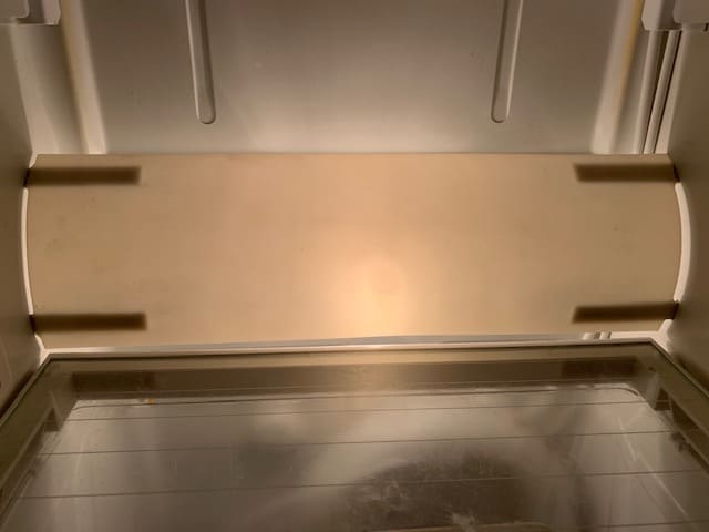 fridge with epoxy repaired light shield installed