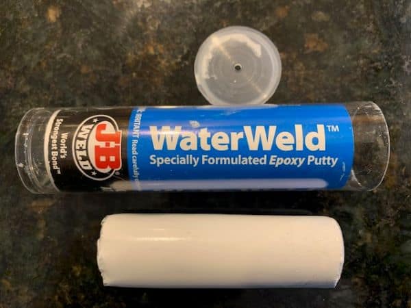 Package of JB Water Weld specialty epoxy on a workbench